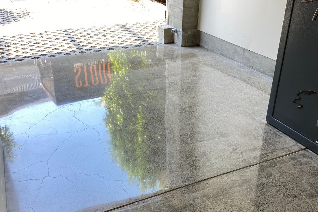 Polished concrete floor in Dana Point highlighting a sleek, glossy surface after expert grinding and polishing services.