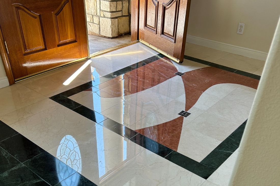 Polished marble floor in a doorway after StoneShine marble polishing service in Huntington Beach